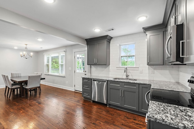 129 Neese Dr, Nashville, TN 37211 - kitchen featuring appliances with stainless steel finishes, a sink, gray cabinets, light stone countertops, and recessed lighting