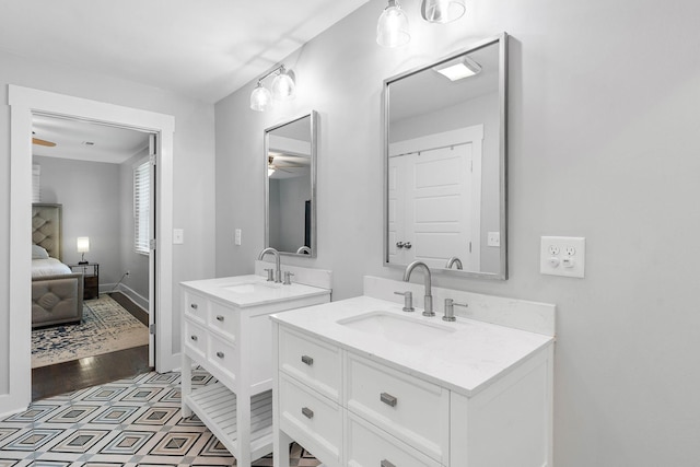 129 Neese Dr, Nashville, TN 37211 - ensuite bathroom with a ceiling fan, two vanities, and baseboards
