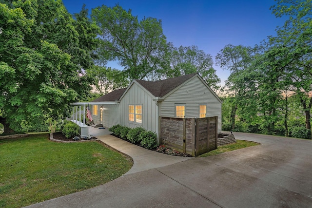 129 Neese Dr, Nashville, TN 37211 - view of front of property with board and batten siding and a front lawn