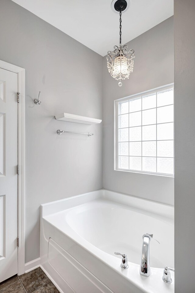 4047 Locerbie Cir, Spring Hill, TN 37174 - full bathroom featuring a garden tub and a chandelier