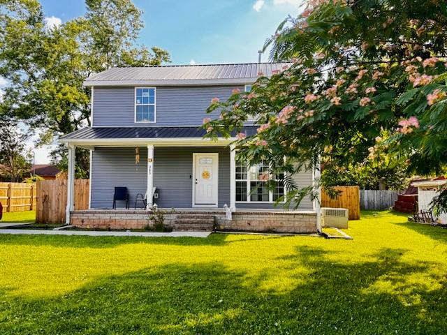 203 5th Ave N, Decherd, TN 37324 - view of front of property featuring a porch, a metal roof, and a standing seam roof