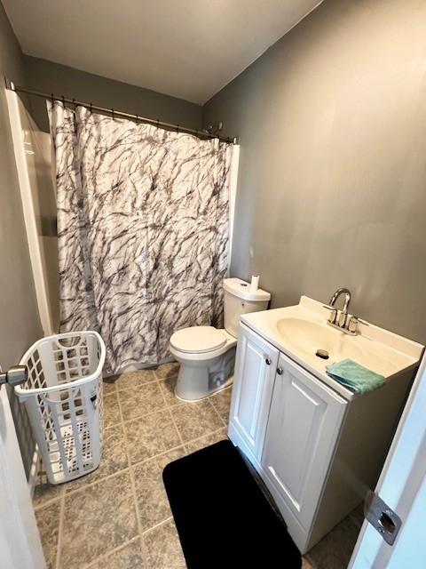 203 5th Ave N, Decherd, TN 37324 - full bath with vanity, tile patterned floors, and a shower with curtain