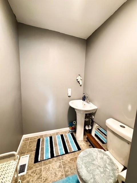 203 5th Ave N, Decherd, TN 37324 - bathroom with toilet and tile patterned floors