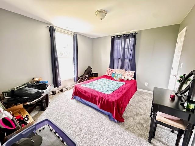 203 5th Ave N, Decherd, TN 37324 - bedroom featuring carpet floors and baseboards