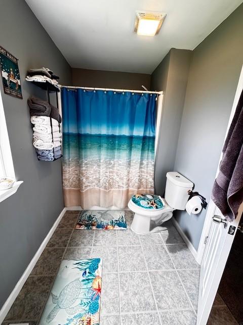 203 5th Ave N, Decherd, TN 37324 - bathroom featuring a shower with shower curtain and tile patterned flooring
