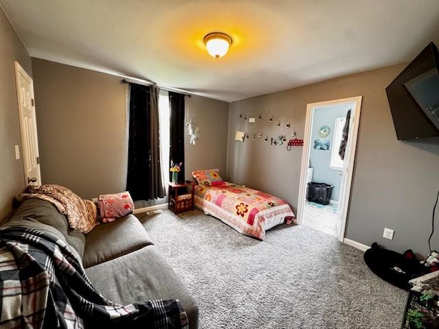 203 5th Ave N, Decherd, TN 37324 - carpeted bedroom with baseboards