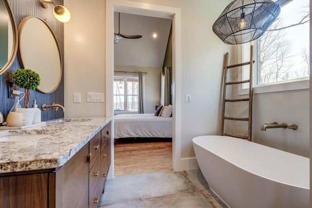 639 Piney Creek Rd, Hohenwald, TN 38462 - ensuite bathroom with vanity, a freestanding tub, and vaulted ceiling