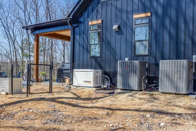 639 Piney Creek Rd, Hohenwald, TN 38462 - view of side of property featuring central AC and board and batten siding