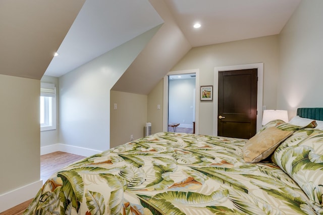 639 Piney Creek Rd, Hohenwald, TN 38462 - bedroom with wood finished floors, baseboards, recessed lighting, and vaulted ceiling