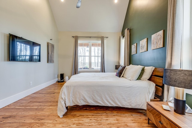 639 Piney Creek Rd, Hohenwald, TN 38462 - bedroom featuring light wood-type flooring, baseboards, and high vaulted ceiling
