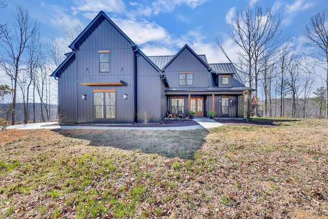 639 Piney Creek Rd, Hohenwald, TN 38462 - view of front of home with metal roof, a standing seam roof, and board and batten siding