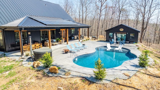 639 Piney Creek Rd, Hohenwald, TN 38462 - outdoor pool featuring a covered hot tub, a patio area, an outdoor hangout area, an outdoor structure, and an exterior structure