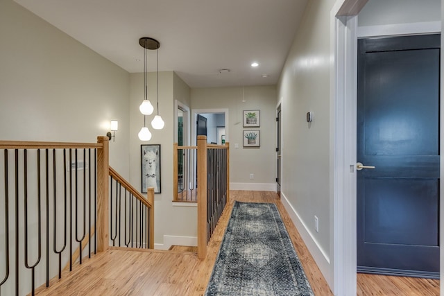 639 Piney Creek Rd, Hohenwald, TN 38462 - hall with wood finished floors, an upstairs landing, attic access, baseboards, and recessed lighting