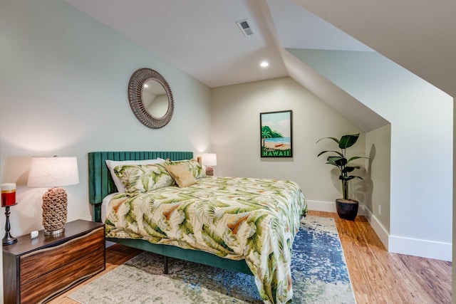 639 Piney Creek Rd, Hohenwald, TN 38462 - bedroom with wood finished floors, recessed lighting, baseboards, and lofted ceiling
