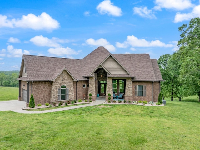 532 Tidwell Rd, Bon Aqua, TN 37025 - craftsman house with a front yard, driveway, roof with shingles, brick siding, and stone siding