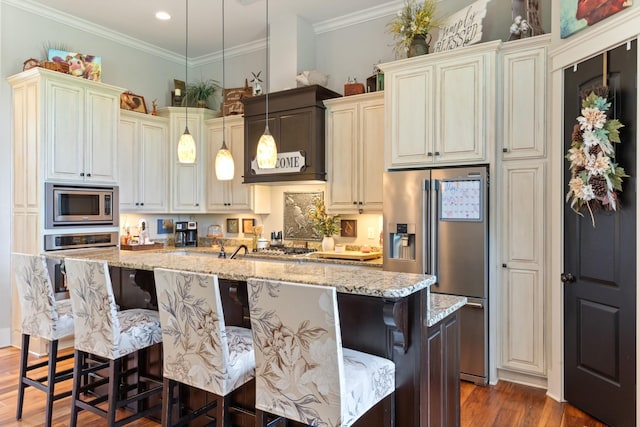 532 Tidwell Rd, Bon Aqua, TN 37025 - kitchen with stainless steel appliances, dark wood-type flooring, a center island with sink, light stone countertops, and recessed lighting