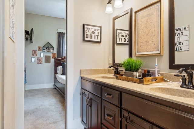 532 Tidwell Rd, Bon Aqua, TN 37025 - ensuite bathroom with double vanity and baseboards