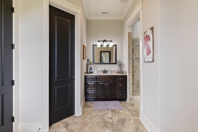 532 Tidwell Rd, Bon Aqua, TN 37025 - full bath featuring ornamental molding, vanity, a tile shower, and baseboards