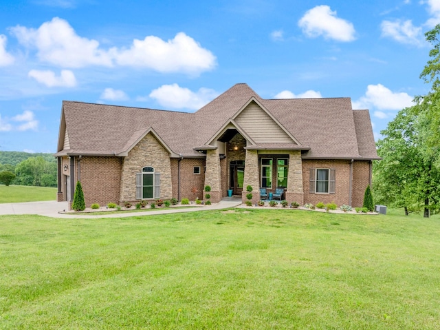 532 Tidwell Rd, Bon Aqua, TN 37025 - view of front of property featuring a front lawn, a shingled roof, and brick siding