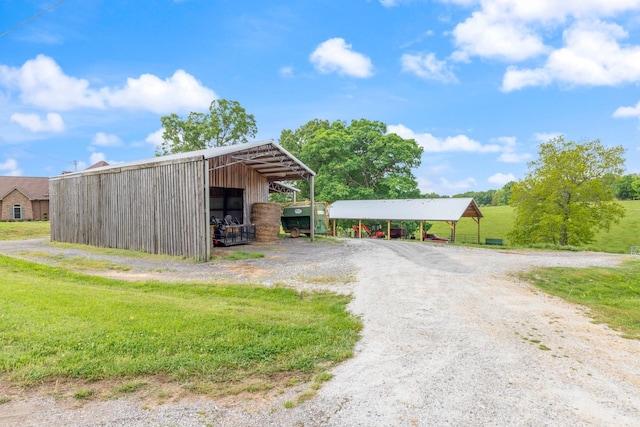 532 Tidwell Rd, Bon Aqua, TN 37025 - view of pole building featuring a carport and driveway