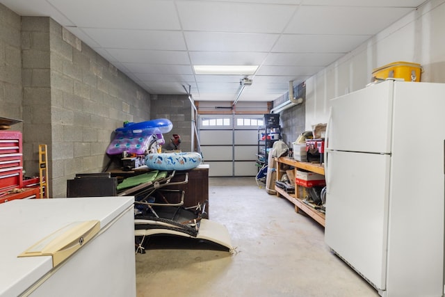 532 Tidwell Rd, Bon Aqua, TN 37025 - garage with freestanding refrigerator and concrete block wall