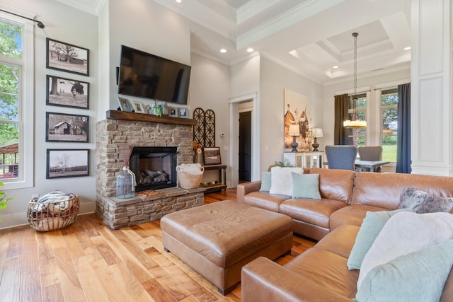 532 Tidwell Rd, Bon Aqua, TN 37025 - living room with crown molding, healthy amount of natural light, light wood-style floors, a stone fireplace, and recessed lighting