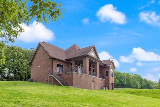 532 Tidwell Rd, Bon Aqua, TN 37025 - view of property exterior with brick siding, cooling unit, a yard, stairs, and roof with shingles