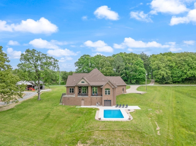 532 Tidwell Rd, Bon Aqua, TN 37025 - back of property featuring brick siding, a lawn, an outdoor pool, and a patio