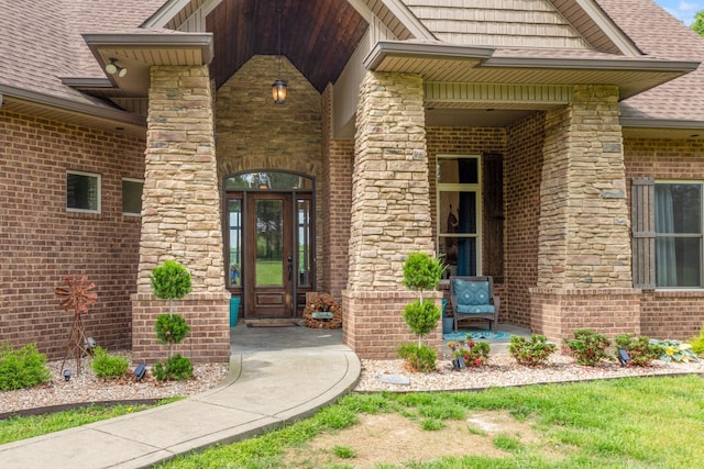 532 Tidwell Rd, Bon Aqua, TN 37025 - doorway to property with brick siding, covered porch, roof with shingles, and stone siding