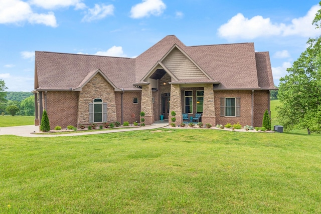 532 Tidwell Rd, Bon Aqua, TN 37025 - craftsman house with a front lawn, roof with shingles, and brick siding