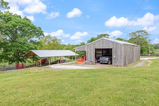 532 Tidwell Rd, Bon Aqua, TN 37025 - view of yard with an outbuilding, an outdoor structure, a garage, and driveway