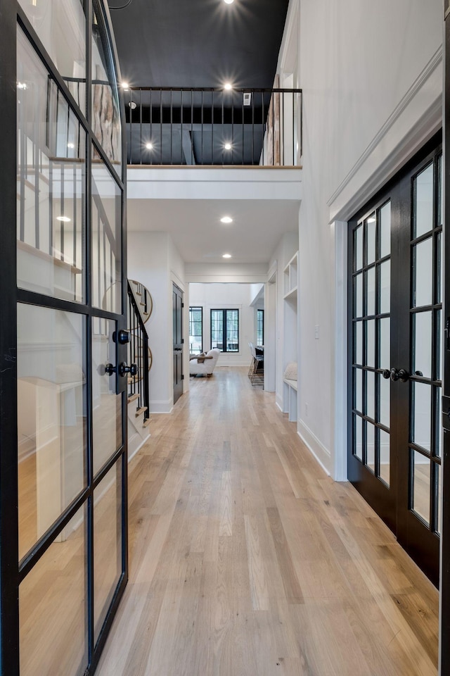 1050 Garton Rd, Burns, TN 37029 - foyer with french doors, a towering ceiling, stairs, wood finished floors, and baseboards