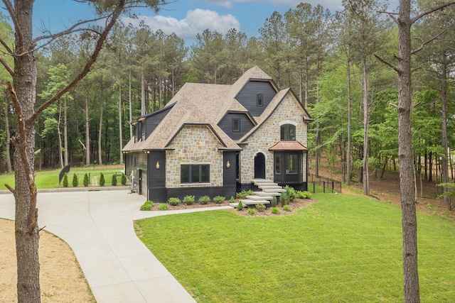 1050 Garton Rd, Burns, TN 37029 - view of front of property with stone siding, driveway, and a front lawn