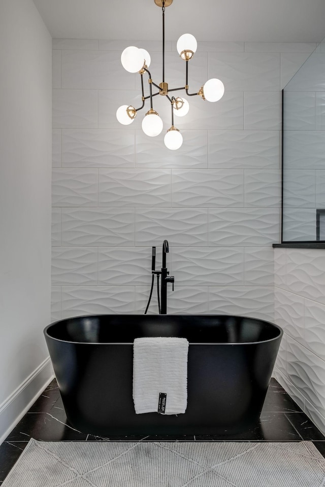 1050 Garton Rd, Burns, TN 37029 - detailed view of a freestanding tub, a sink, baseboards, and tile walls
