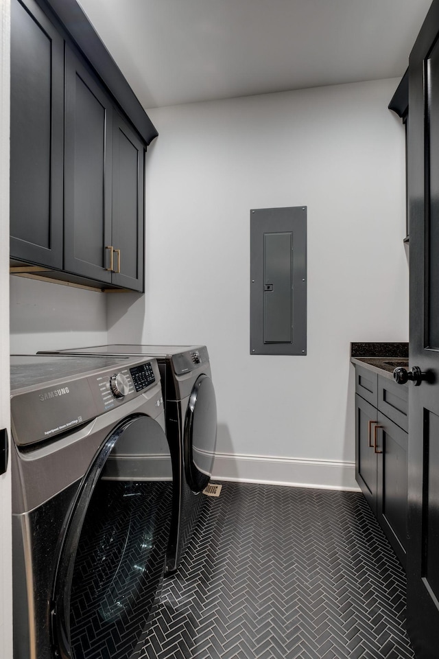 1050 Garton Rd, Burns, TN 37029 - laundry room with electric panel, cabinet space, washing machine and dryer, and baseboards