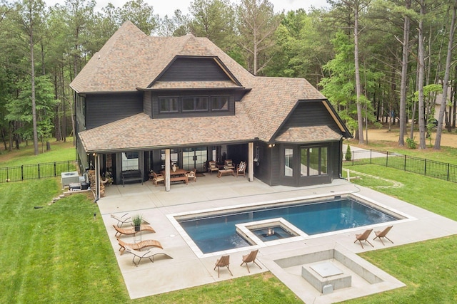1050 Garton Rd, Burns, TN 37029 - back of house featuring a patio, a shingled roof, an outdoor living space, and a pool with connected hot tub