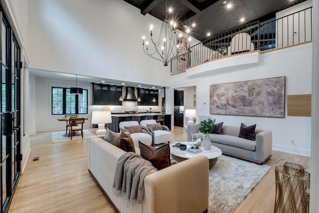 1050 Garton Rd, Burns, TN 37029 - living room with a towering ceiling, light wood-type flooring, baseboards, beamed ceiling, and coffered ceiling