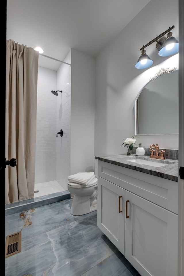 1050 Garton Rd, Burns, TN 37029 - full bath featuring toilet, a tile shower, and vanity