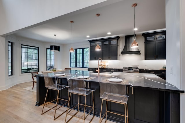 1050 Garton Rd, Burns, TN 37029 - kitchen featuring premium range hood, a sink, dark cabinetry, gas range, and recessed lighting