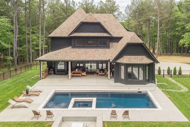 1050 Garton Rd, Burns, TN 37029 - rear view of house with roof with shingles, a patio area, outdoor lounge area, and an in-ground hot tub