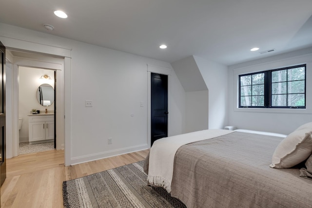 1050 Garton Rd, Burns, TN 37029 - bedroom with light wood-style floors, recessed lighting, baseboards, and ensuite bathroom