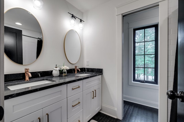 1050 Garton Rd, Burns, TN 37029 - full bath featuring double vanity, tile patterned floors, and baseboards