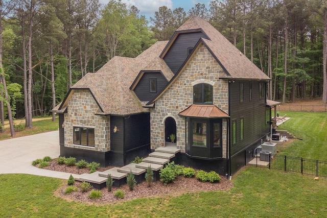1050 Garton Rd, Burns, TN 37029 - french provincial home featuring stone siding and a view of trees