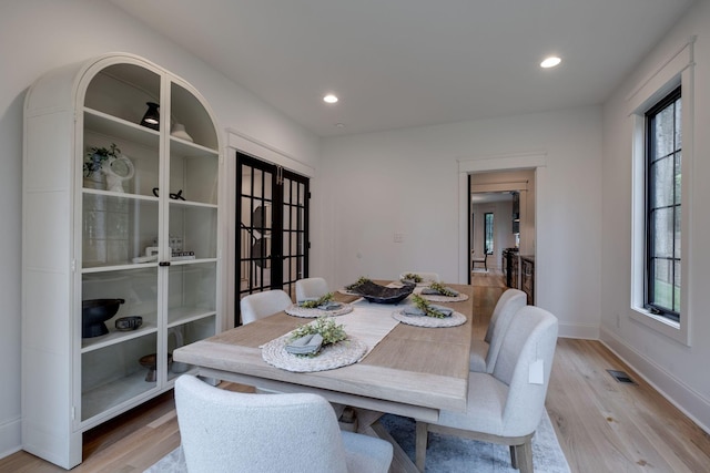 1050 Garton Rd, Burns, TN 37029 - dining area featuring light wood-style floors, plenty of natural light, french doors, baseboards, and recessed lighting