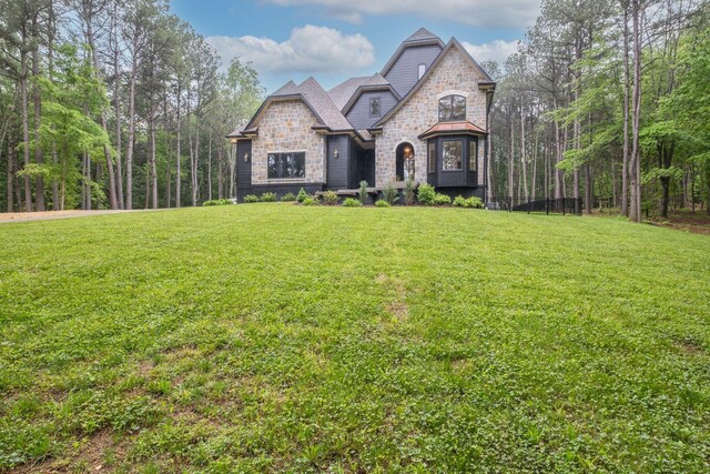1050 Garton Rd, Burns, TN 37029 - french provincial home with stone siding and a front yard