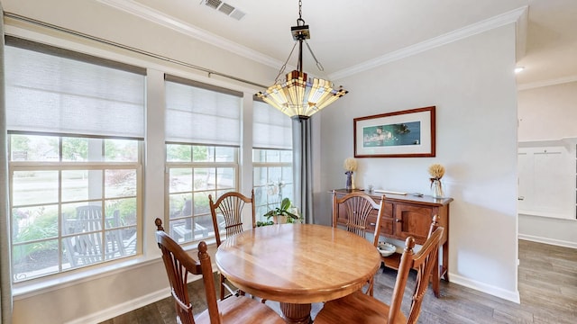 1106 Davidson Walk, Spring Hill, TN 37174 - dining area with healthy amount of natural light, wood finished floors, baseboards, and ornamental molding