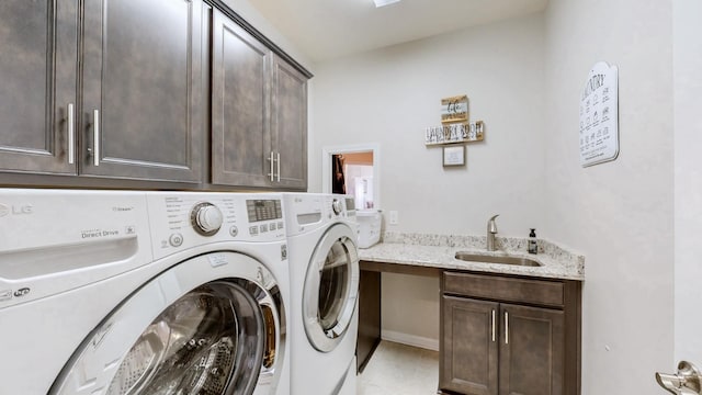 1106 Davidson Walk, Spring Hill, TN 37174 - laundry area featuring cabinet space, washer and dryer, and light tile patterned floors