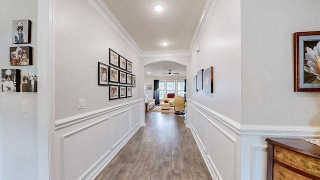 1106 Davidson Walk, Spring Hill, TN 37174 - hall with wainscoting, crown molding, a decorative wall, wood finished floors, and arched walkways