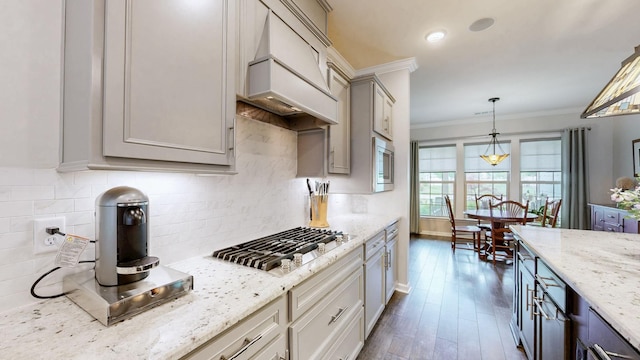 1106 Davidson Walk, Spring Hill, TN 37174 - kitchen featuring premium range hood, ornamental molding, appliances with stainless steel finishes, hanging light fixtures, and light stone counters