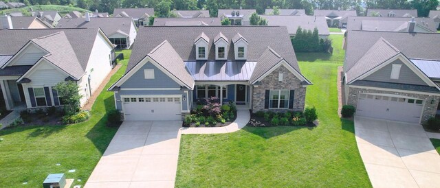 1106 Davidson Walk, Spring Hill, TN 37174 - view of front facade featuring driveway, stone siding, a garage, and a front lawn